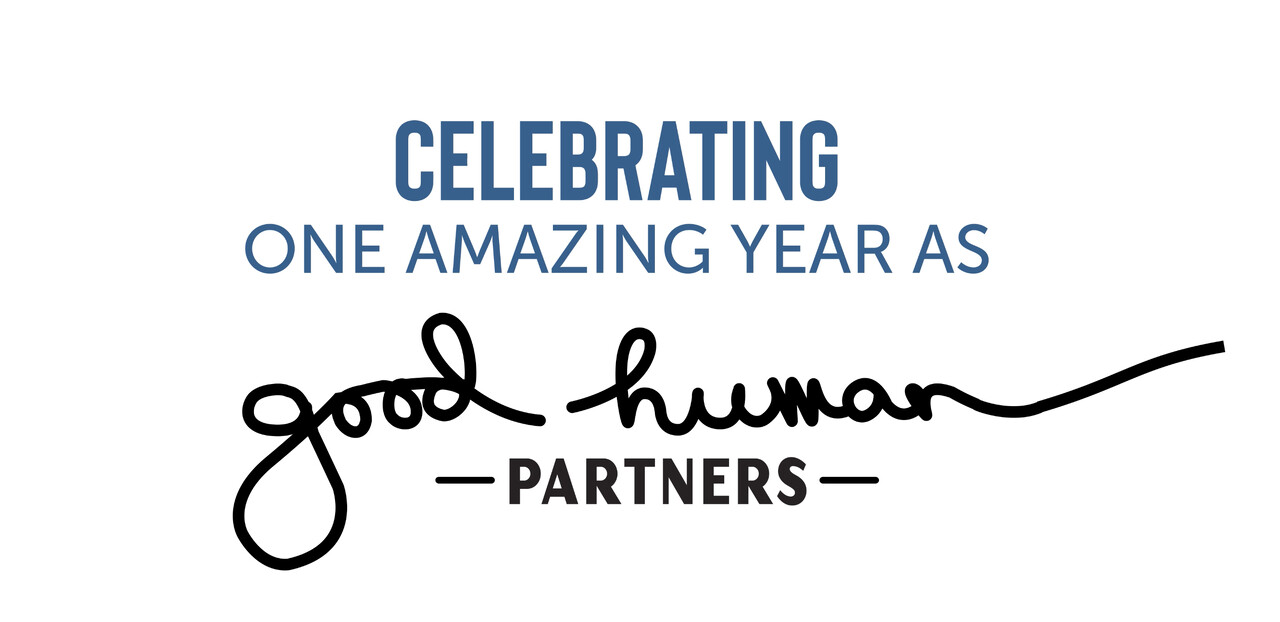 "Celebrating one amazing year as Good Human Partners" in blue and black lettering on white.